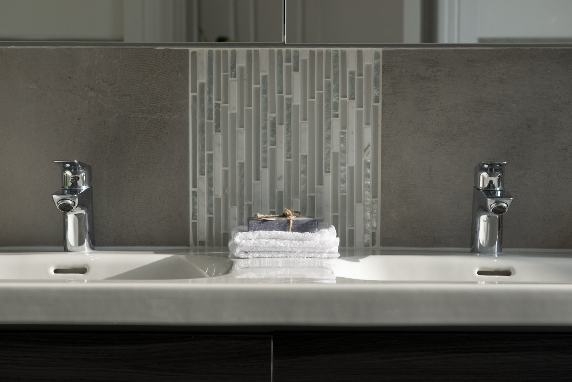 Detail of bathroom vanity and tiles