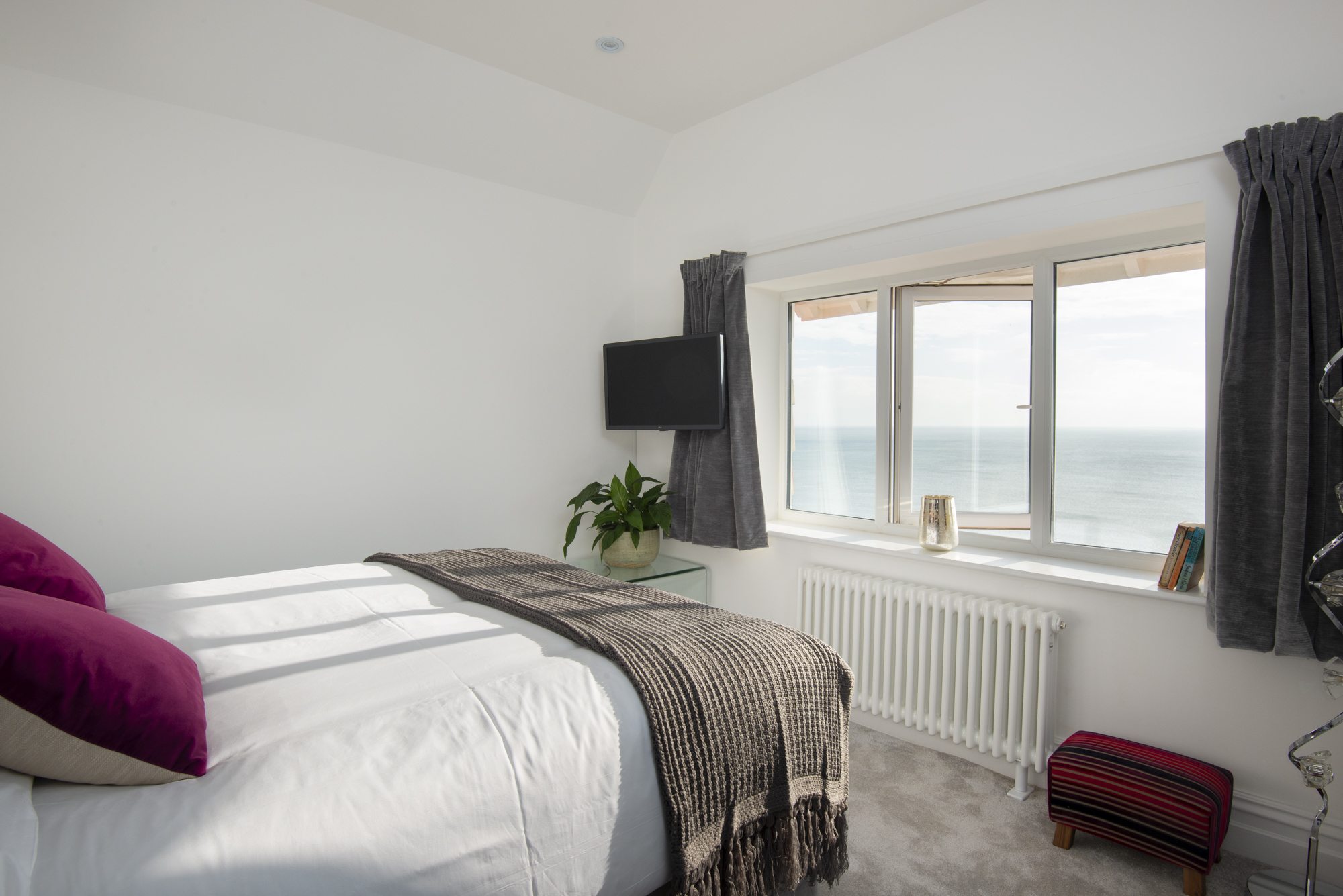 Bedroom 4 — king or twin beds with sea views and ensuite shower