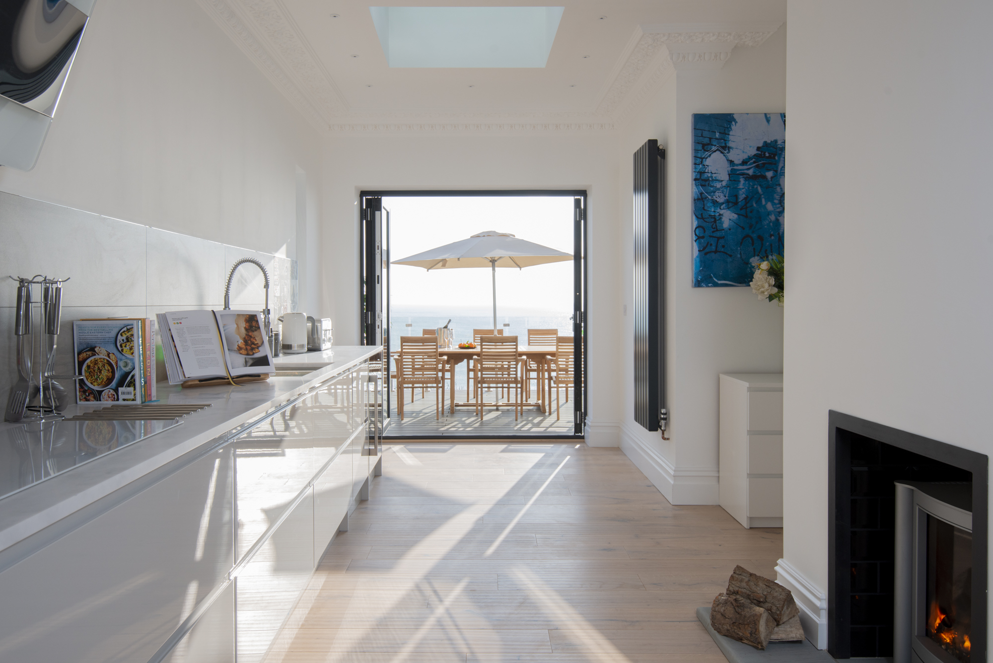 Cliffhanger House kitchen opening onto sea terrace