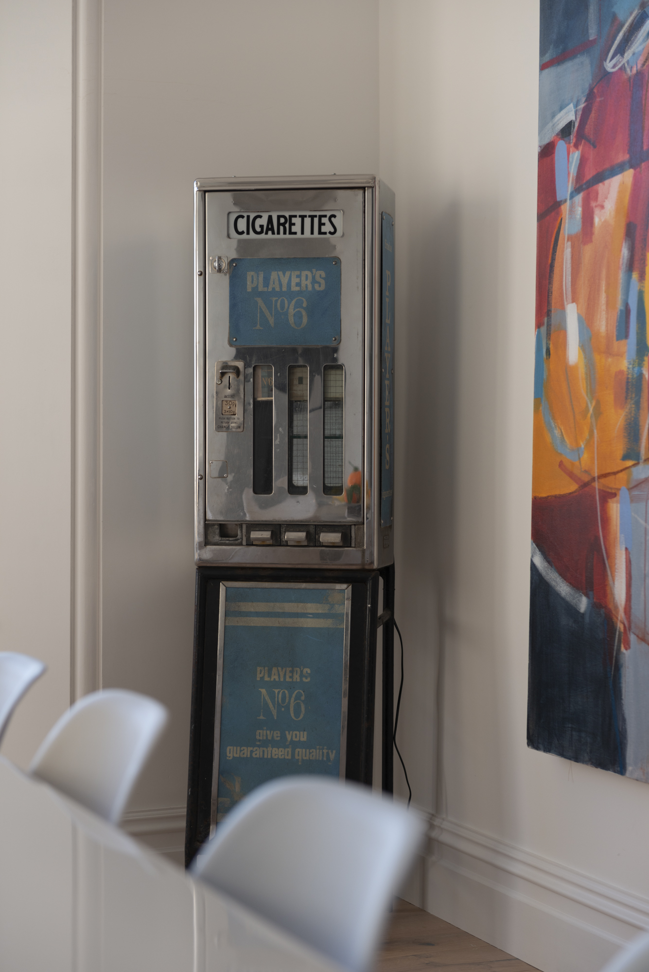 Vintage cigarette machine and artwork