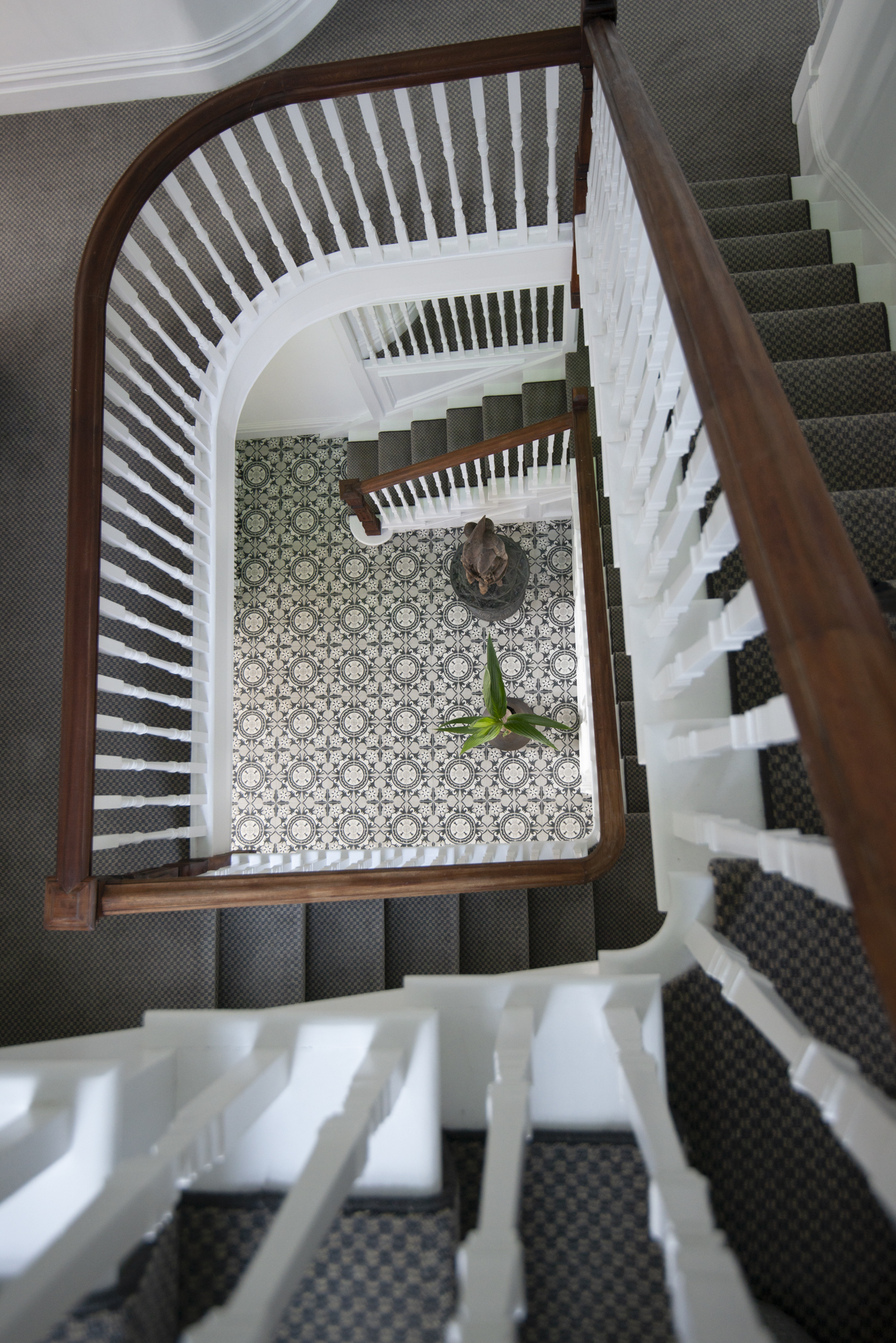 Staircase looking down to tiled entrance hall