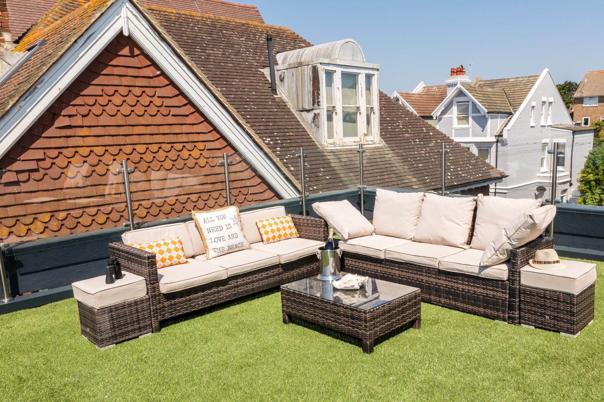 Sun terrace with rattan sofa and sea views